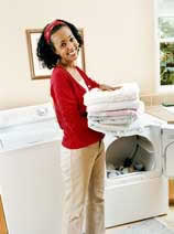 Woman holding folded launcdry