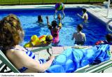 Woman and children in pool
